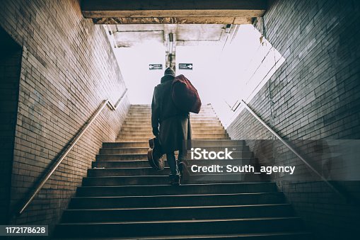 istock Street performer walking up the steps 1172178628
