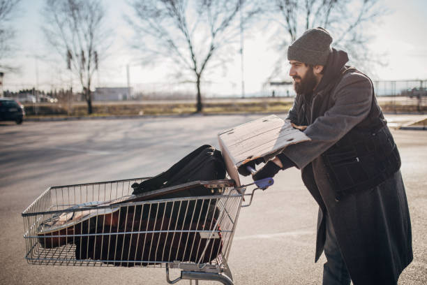 istock Homeless man with shopping cart 1172179039