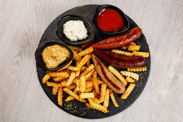 istock Delicious sausage served with fries 1172179631