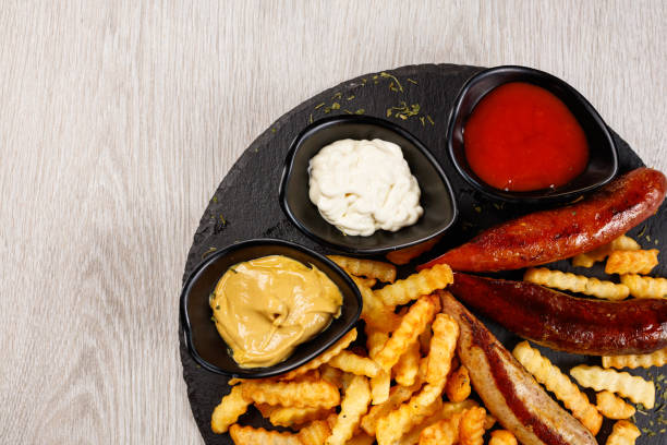 istock Delicious sausage served with fries 1172180615