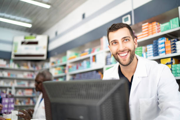 istock Happy pharmacist working in a drugstore 1172180671