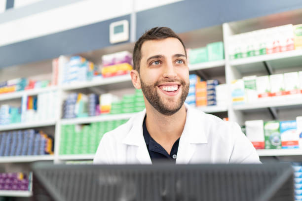 istock Happy pharmacist working in a drugstore 1172181005