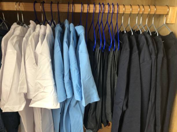 Wardrobe full of uniform School uniform hanging in wardrobe school uniform stock pictures, royalty-free photos & images