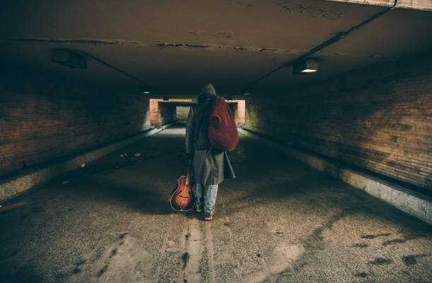 istock Homeless man walking away 1172182980