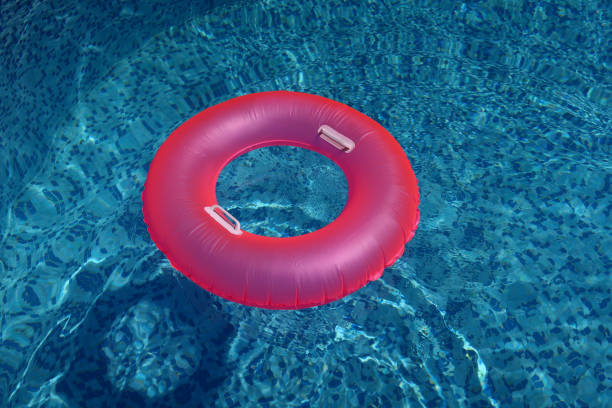 istock Pink swim ring on the swimming pool 1172183044