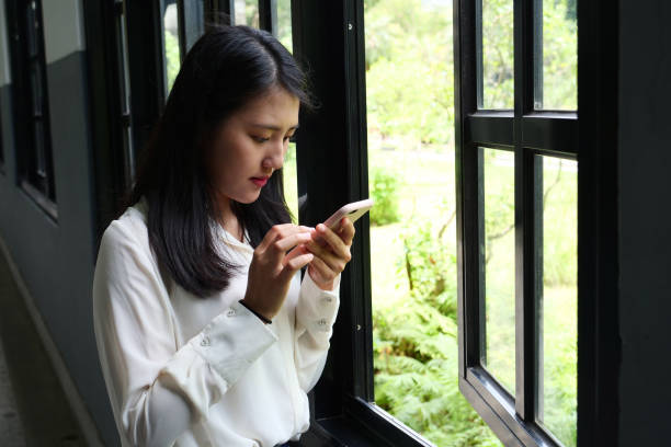 istock Young woman student relaxing beside window 1172183574
