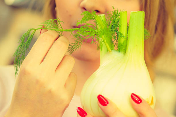 istock Woman holding fennel bulb 1172183969
