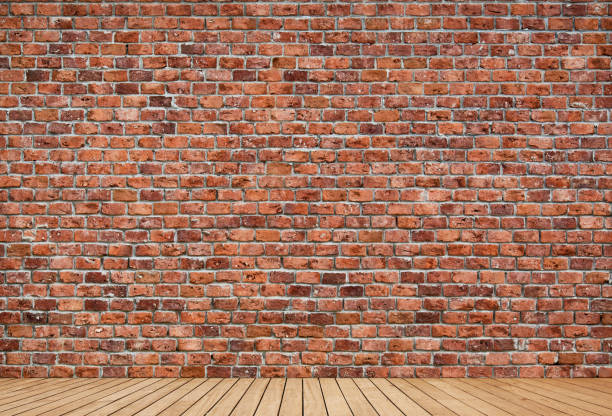Brick wall and wooden floor domestic room stock photo