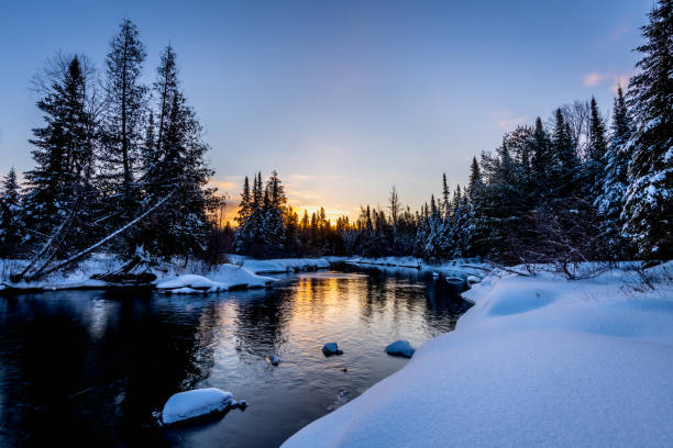 istock Sunrise over a creek in winter 1172188821