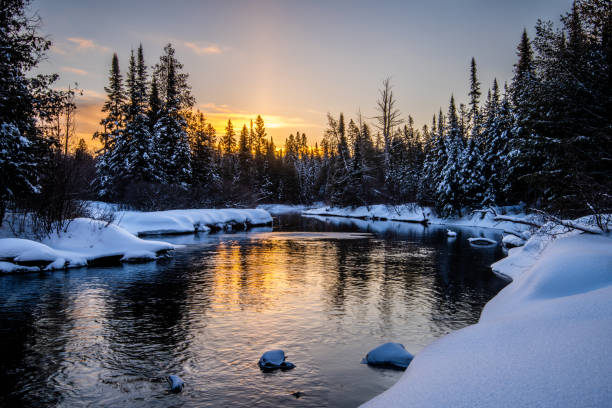 istock Sunrise over a creek in winter 1172188823