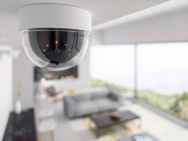 telecamera di sicurezza in soggiorno - security camera installing security system security foto e immagini stock