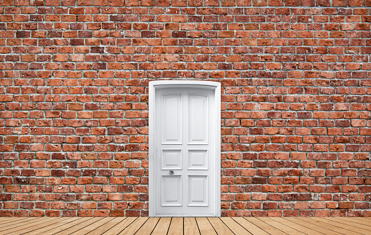 Closed White Door on Brick Wall