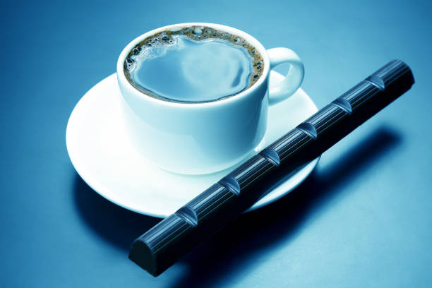 istock white cup with black coffee and chocolate on the saucer 1172193015