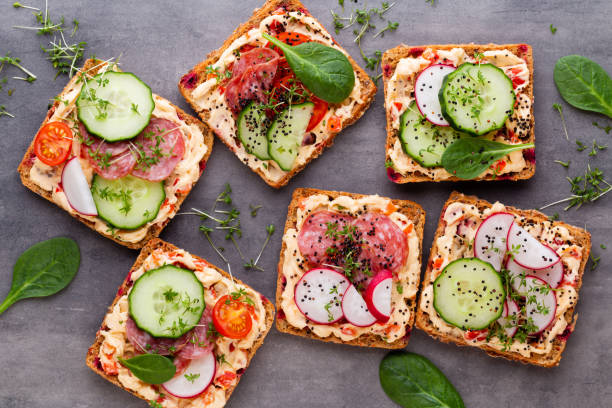 istock Sandwiches with cream cheese, vegetables and salami. 1172196240