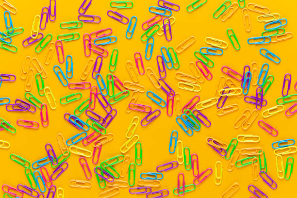 istock Paper color clip notebook on yellow background. Flat lay. 1172196492