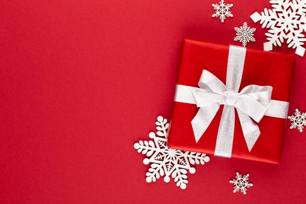 istock Christmas, holiday present box on red background. 1172196929