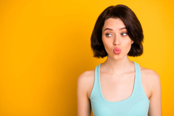 istock Copyspace photo of curious cunning sly girlfriend plumping you through camera while isolated with yellow background 1172197117