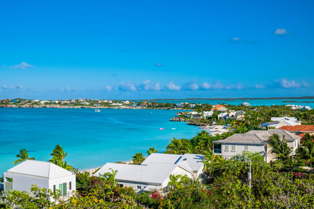 Stocking Island, Bahamas - November 28, 2014: a view of The store near the Famous Chat'n'chill Conch bar in Stocking Island, viewed from restaurant entrance. Some palm trees on the beach. In background the Turtle bay  (Exuma - Bahamas). 