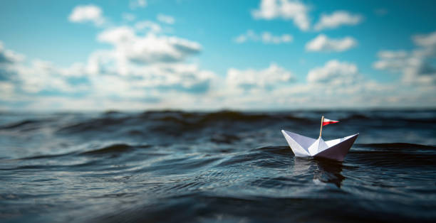 istock Paper ship on the high seas | Panorama 1172199373