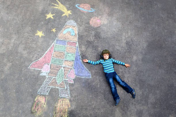 istock little kid boy flying by a space shuttle chalks picture 1172200571