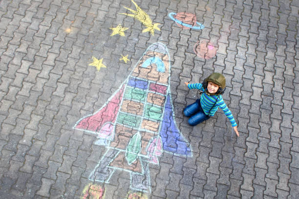 istock little kid boy flying by a space shuttle chalks picture 1172200586