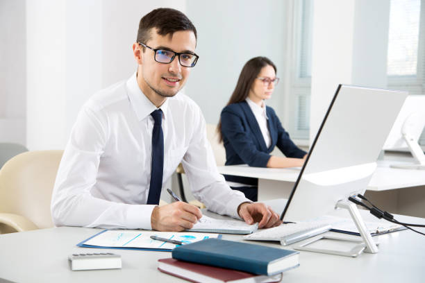 istock Young businessman smiling looking at camera 1172200965