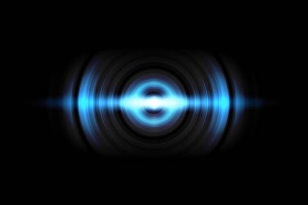 istock Abstract light blue circle effect with sound waves oscillating on black background 1172202771