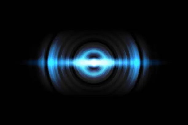 Photo of Abstract light blue circle effect with sound waves oscillating on black background