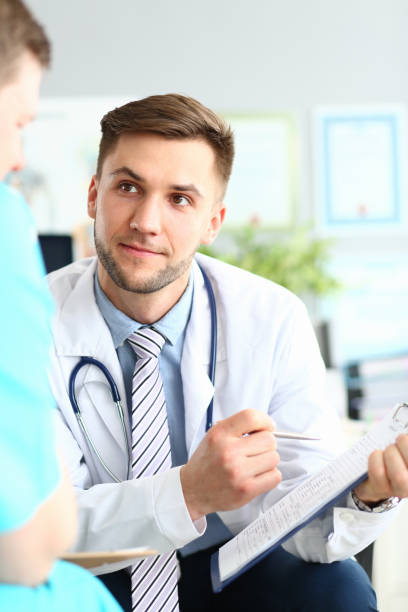 istock Intelligent doctor with paper folder 1172205097