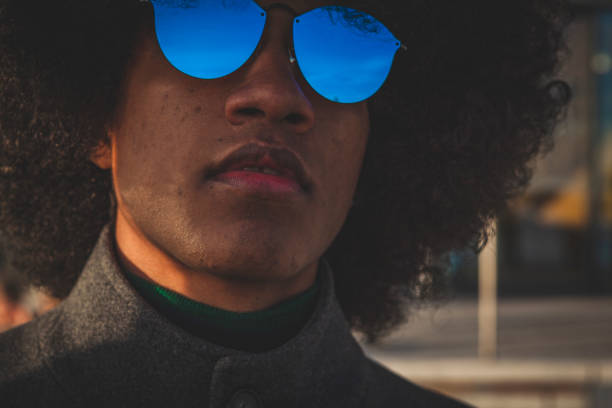 istock Young male with afro and sunglasses 1172205546