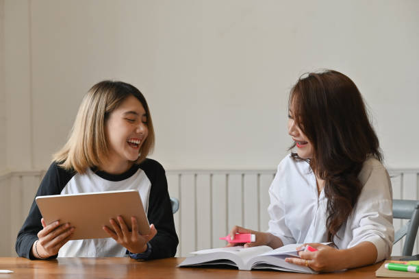 istock Female together using tablet and talking with education concept. 1172205586