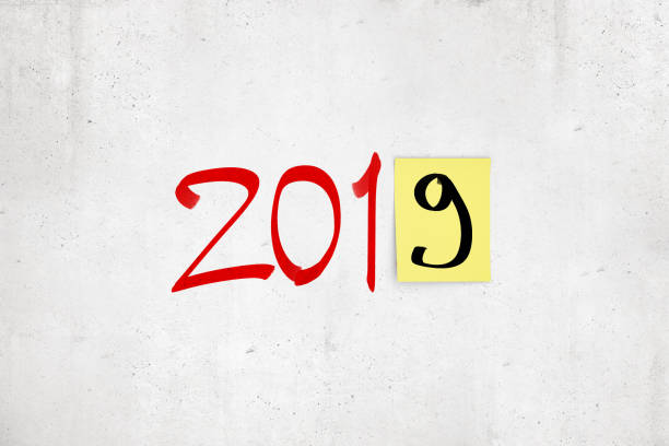 istock 3d rendering of '2019' red marker sign with black '9' on post-it yellow note on white background 1172207308