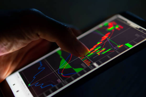 istock Man touch candlestick chart from stock market on smartphone 1172210510