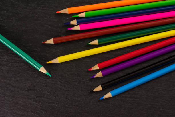 istock Vibrant colored pencil on grey stone 1172211745