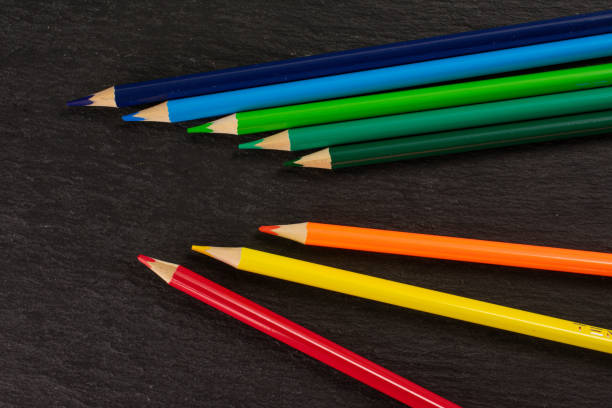 istock Vibrant colored pencil on grey stone 1172211747