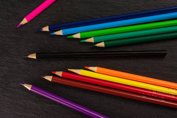 istock Vibrant colored pencil on grey stone 1172211748