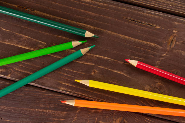 istock Vibrant colored pencil on brown wood 1172212039