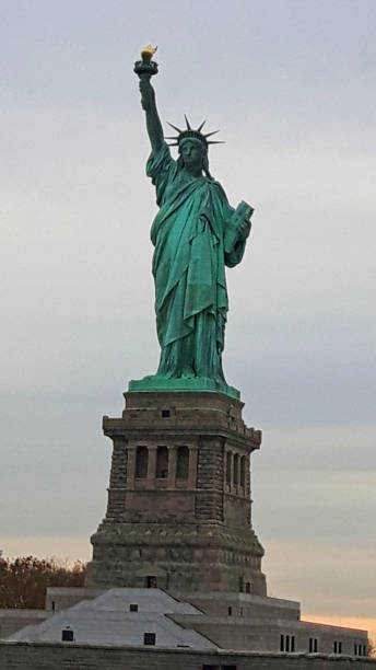 istock the statue of liberty at sunset 1172212082