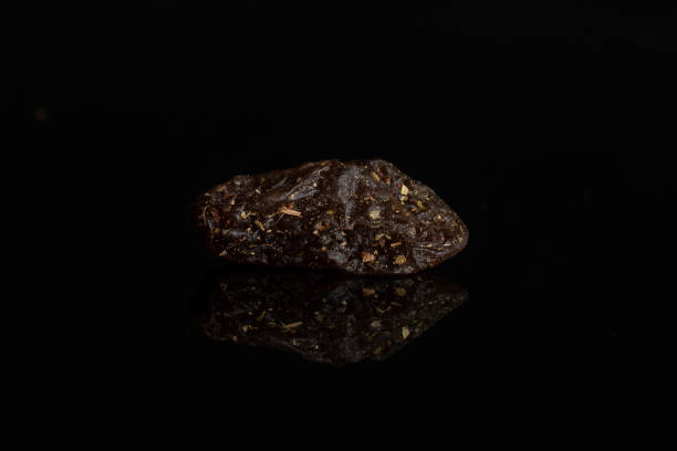 istock Mixed fruit tea isolated on black glass 1172212623