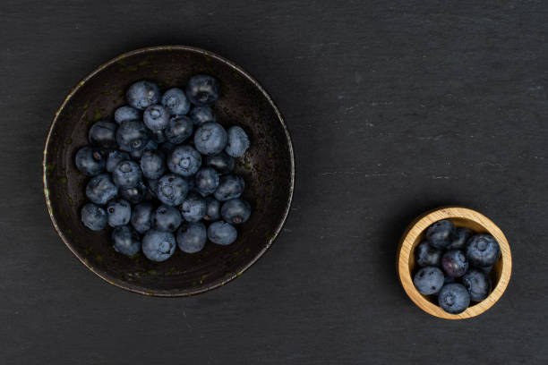 istock Fresj blue bilberry on grey stone 1172213433