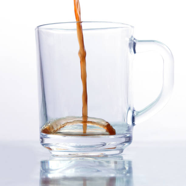 istock black coffee is poured in a transparent mug on a white background 1172214717
