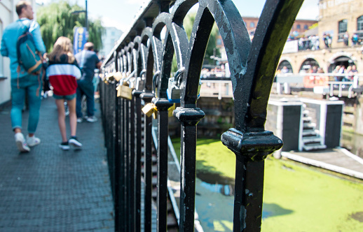 August 18, 2019 – Camden Lock, London, United Kingdom. Padlocks are locked along the fence line by couples, families and friends to remember moments and those who are no longer with us,