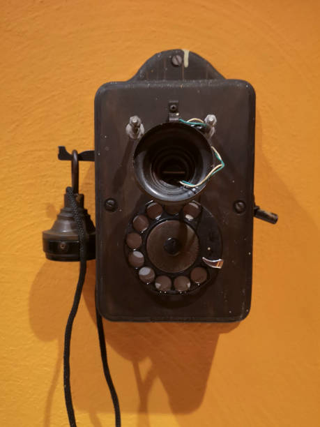 istock Old telephone on orange wall 1172218313