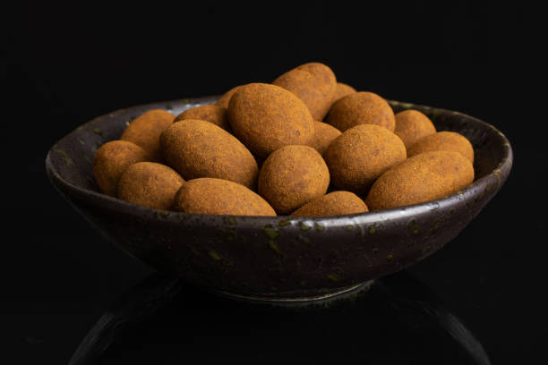 istock Chocolate cinnamon almond isolated on black glass 1172218613