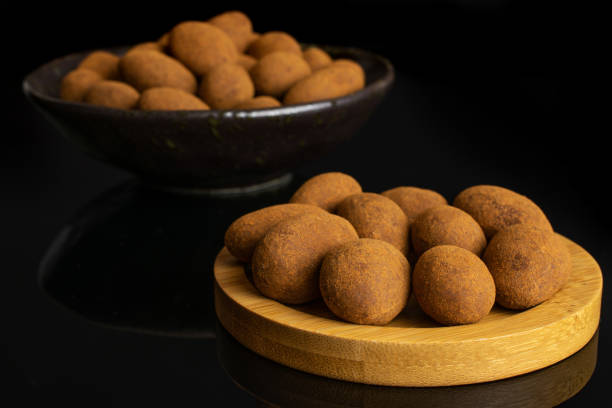 istock Chocolate cinnamon almond isolated on black glass 1172218620