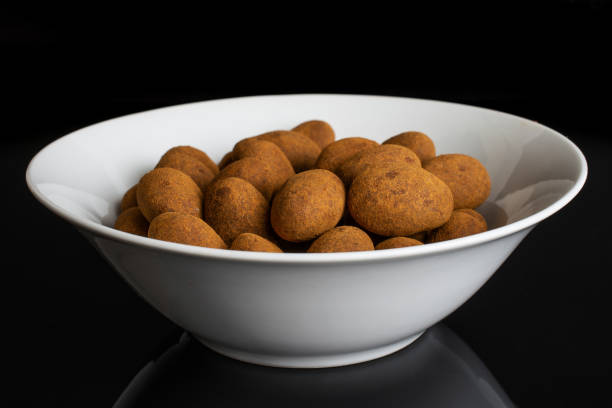 istock Chocolate cinnamon almond isolated on black glass 1172218709