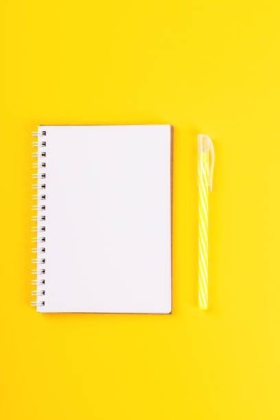 istock Notebook, and pen on a bright yellow background.Accessories office concept.Business Idea. Time to school.Top View.Flat Lay. Copy space for Text. 1172220189