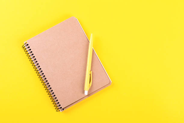 istock Notebook, and pen on a bright yellow background.Accessories office concept.Business Idea. Time to school.Top View.Flat Lay. Copy space for Text. 1172220191