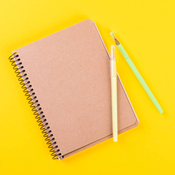 istock Notebook, and pen on a bright yellow background.Accessories office concept.Business Idea. Time to school.Top View.Flat Lay. Copy space for Text. 1172220198