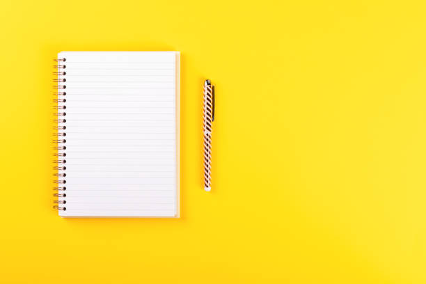 istock Notebook, and pen on a bright yellow background.Accessories office concept.Business Idea. Time to school.Top View.Flat Lay. Copy space for Text. 1172220202
